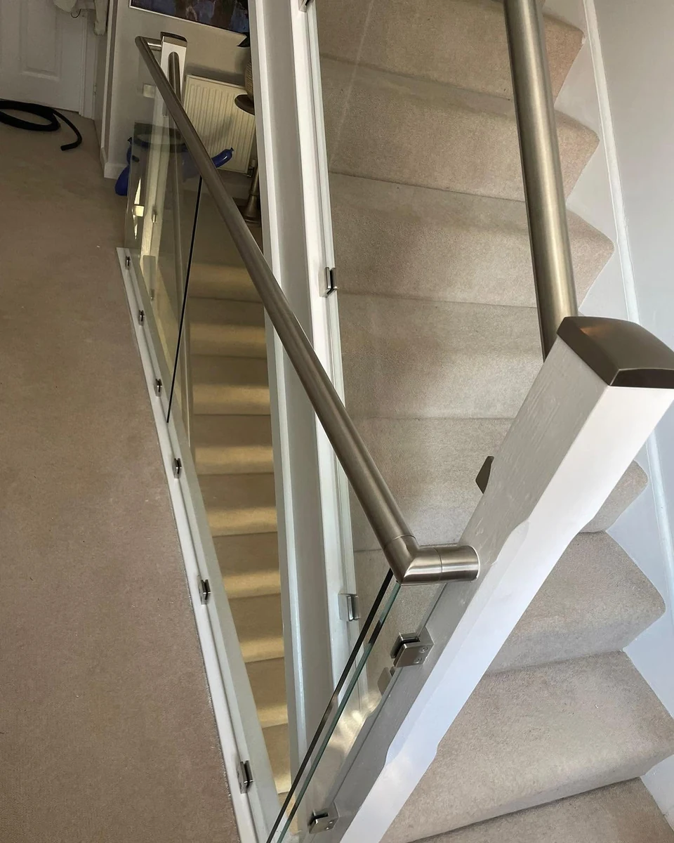 Glass balustrade staircase with stainless steel handrail run line, Farnham Glass Balustrades